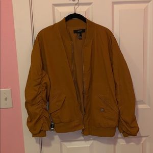 yellowish tan bomber jacket